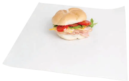 Sandwich sitting on a white greaseproof wrap sheet