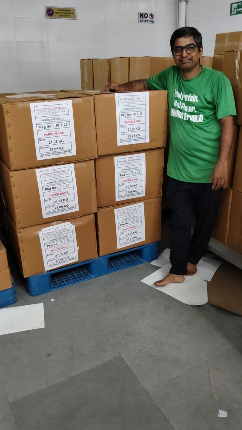 Labelled cartons of paper bags for Hummus Republic stacked on a pallet, ready for export