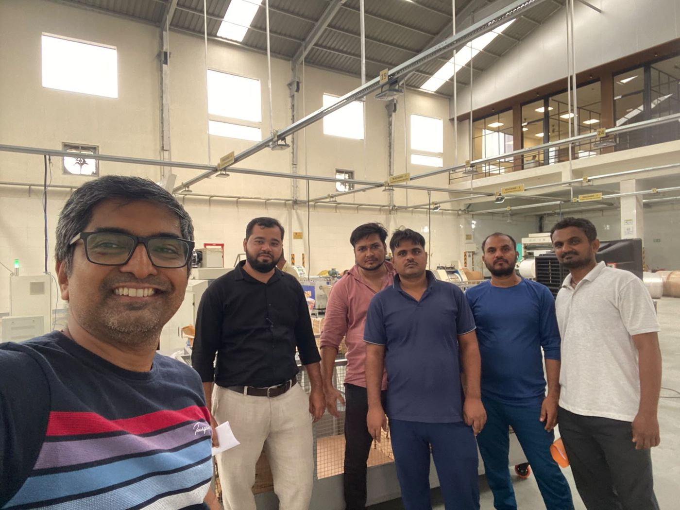 The Ecotray Solutions team on the production floor of the paper bag factory